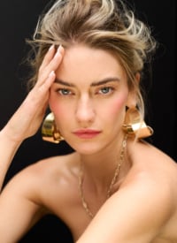 Beauty portrait featuring minimal makeup and delicate styling details