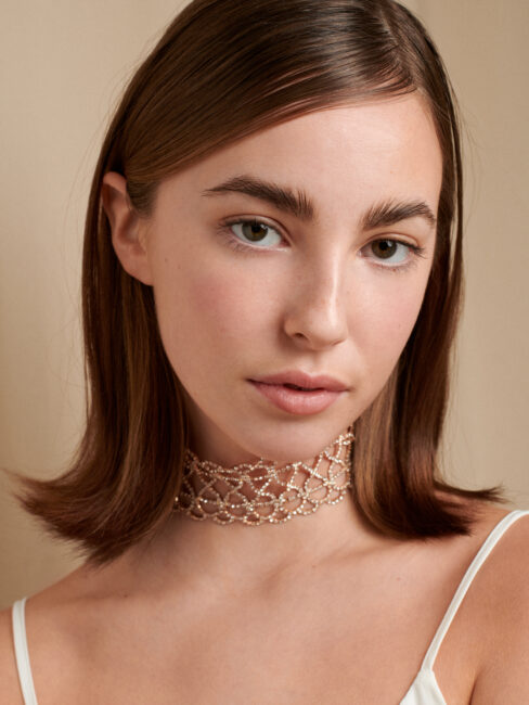 Clean studio beauty portrait with natural makeup and soft lighting