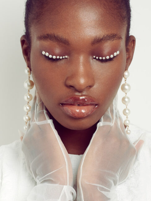 Beauty portrait featuring minimal makeup and delicate styling details